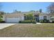 Charming single-story home with well-maintained landscaping and a two-car garage at 610 147Th St E, Bradenton, FL 34212