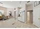 A kitchen with white appliances and cabinets with tiled floor at 610 147Th St E, Bradenton, FL 34212