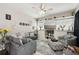 Warm and inviting living room with plush seating, decorative elements, and natural light at 610 147Th St E, Bradenton, FL 34212