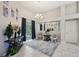 Open-concept living room featuring an ornate rug and decorative lighting fixtures at 610 147Th St E, Bradenton, FL 34212