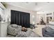 Cozy living room with tile floors, dark curtains, and comfortable seating at 610 147Th St E, Bradenton, FL 34212