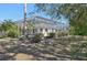 An expansive screened-in pool and spa overlook the beautifully landscaped yard at 610 147Th St E, Bradenton, FL 34212
