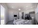 Spacious bedroom featuring a ceiling fan, workspace, and a walk-out balcony at 610 Hibiscus Way, Longboat Key, FL 34228