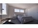 Comfortable bedroom with textured walls, dual windows, and a spacious closet at 610 Hibiscus Way, Longboat Key, FL 34228