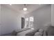 Bright bedroom with neutral tones, a ceiling fan, and sliding doors to an outdoor space at 610 Hibiscus Way, Longboat Key, FL 34228