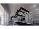 Bright living room showcasing modern lighting, a fireplace, and an open-concept design at 610 Hibiscus Way, Longboat Key, FL 34228