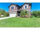 Charming two-story home features a well-manicured lawn and a two-car garage at 6138 100Th E Ave, Parrish, FL 34219