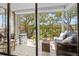 Relaxing screened balcony with comfortable seating, perfect for enjoying the outdoor view at 6269 Palma Del Mar S Blvd # 308, St Petersburg, FL 33715