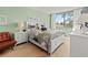 Cozy bedroom with a large window, providing plenty of natural light at 6269 Palma Del Mar S Blvd # 308, St Petersburg, FL 33715