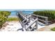 White wooden dock provides access to tranquil waters and serene waterfront scenery at 6269 Palma Del Mar S Blvd # 308, St Petersburg, FL 33715