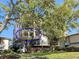 Multi-story residential building exhibits lush greenery and multiple levels of outdoor balconies at 6269 Palma Del Mar S Blvd # 308, St Petersburg, FL 33715