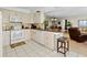A bright and inviting kitchen area with appliances and a breakfast bar at 6269 Palma Del Mar S Blvd # 308, St Petersburg, FL 33715