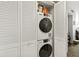 Convenient laundry closet with stacked washer and dryer, maximizing space and efficiency at 6269 Palma Del Mar S Blvd # 308, St Petersburg, FL 33715