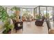 A cozy living room filled with bright light, wicker furniture, and a hardwood floor at 6269 Palma Del Mar S Blvd # 308, St Petersburg, FL 33715