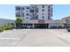 Exterior shot of the building with parking and covered parking garage at 6269 Palma Del Mar S Blvd # 308, St Petersburg, FL 33715
