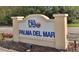 Community sign reading 'Isla Del Sol, Palma Del Mar' with lush foliage in foreground at 6269 Palma Del Mar S Blvd # 308, St Petersburg, FL 33715