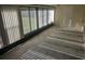 Bright sunroom with lots of windows and tile flooring at 6403 Heritage Ln # 6403, Bradenton, FL 34209