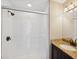 Bathroom features a glass shower with white tile and a granite countertop vanity at 6412 Rosefinch Ct # 102, Lakewood Ranch, FL 34202