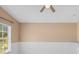 This bedroom features a neutral color palette, and a large window for natural light at 6412 Rosefinch Ct # 102, Lakewood Ranch, FL 34202