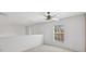 Bright bedroom featuring a ceiling fan and a window offering natural light at 6412 Rosefinch Ct # 102, Lakewood Ranch, FL 34202