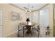 Bright dining room featuring neutral paint, a chandelier and a round table with four chairs at 6412 Rosefinch Ct # 102, Lakewood Ranch, FL 34202
