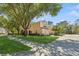 Charming light yellow townhome with a well-manicured lawn and mature shade trees at 6412 Rosefinch Ct # 102, Lakewood Ranch, FL 34202