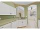 Kitchen sink with view to the living room and staircase at 6412 Rosefinch Ct # 102, Lakewood Ranch, FL 34202