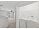 Convenient laundry area features a washer and dryer, with easy access to additional living space at 6412 Rosefinch Ct # 102, Lakewood Ranch, FL 34202
