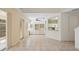Open-concept living space with tile flooring, cabinets, and natural light at 6412 Rosefinch Ct # 102, Lakewood Ranch, FL 34202