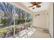 This cozy screened porch features a ceiling fan and plenty of natural light at 6412 Rosefinch Ct # 102, Lakewood Ranch, FL 34202