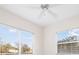 This bedroom boasts two windows with blinds and a ceiling fan, creating a bright and airy space at 664 Silk Oak Dr, Venice, FL 34293