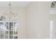 Bright room with a chandelier and a large window that provide lots of natural light at 664 Silk Oak Dr, Venice, FL 34293