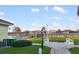 View of a fenced pool area from the outside, with distant view of residential homes at 664 Silk Oak Dr, Venice, FL 34293