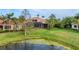 Large backyard with a pond view at 6822 Dominion Ln, Lakewood Ranch, FL 34202