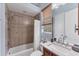 Bathroom featuring a tub and shower combination with tiled surround and a single sink vanity at 6822 Dominion Ln, Lakewood Ranch, FL 34202