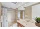 An updated bathroom with tile floors, a glass shower, and a modern vanity at 6822 Dominion Ln, Lakewood Ranch, FL 34202