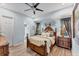 A charming bedroom with an ornate wooden bed frame and soft, yellow bedding at 6822 Dominion Ln, Lakewood Ranch, FL 34202