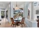 The breakfast nook has beautiful views of the pool and outdoor living area at 6822 Dominion Ln, Lakewood Ranch, FL 34202