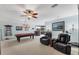 A spacious game room with a pool table, a bar area, and comfortable seating at 6822 Dominion Ln, Lakewood Ranch, FL 34202