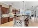 Spacious kitchen with a large island, wine rack, stainless steel appliances, and custom cabinetry at 6822 Dominion Ln, Lakewood Ranch, FL 34202
