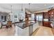 Spacious gourmet kitchen features custom cabinetry, stainless appliances, and an island at 6822 Dominion Ln, Lakewood Ranch, FL 34202