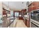 Well-equipped kitchen with a large island, stainless steel appliances, and custom cabinetry at 6822 Dominion Ln, Lakewood Ranch, FL 34202