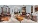 Inviting living room featuring a comfortable leather sofa, stylish decor, and views into the dining area at 6822 Dominion Ln, Lakewood Ranch, FL 34202