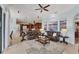 The living room with kitchen features an open layout, tile floors, and natural light at 6822 Dominion Ln, Lakewood Ranch, FL 34202