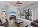 This living room overlooks the pool and patio, with access through sliding glass doors at 6822 Dominion Ln, Lakewood Ranch, FL 34202