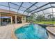Beautiful in-ground pool with a hot tub and a screened enclosure for endless outdoor entertainment at 6822 Dominion Ln, Lakewood Ranch, FL 34202