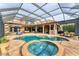 Lovely pool and spa with brick patio in screened-in enclosure at 6822 Dominion Ln, Lakewood Ranch, FL 34202