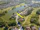 Aerial view showcases lakeside homes with golf course access, highlighting premier community amenities at 711 Planters Manor Way, Bradenton, FL 34212