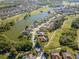 Aerial view showcases lakeside homes with golf course access, highlighting premier community amenities at 711 Planters Manor Way, Bradenton, FL 34212