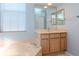 Elegant bathroom with a soaking tub, a vanity with mirrors, and modern fixtures at 711 Planters Manor Way, Bradenton, FL 34212